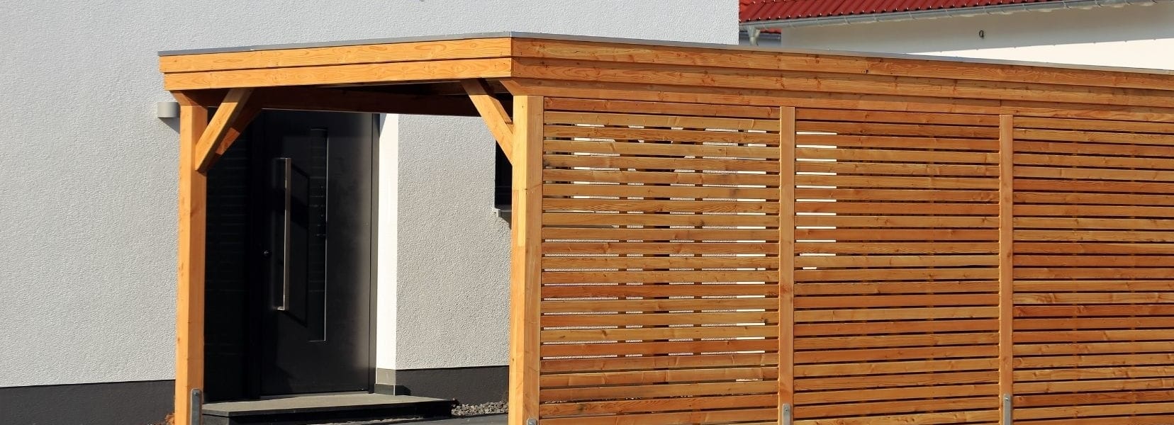 Timber slat carport attached to the entrance of a house