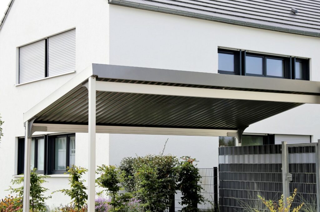 Modern carport attached to a house, built by Carports Townsville Experts