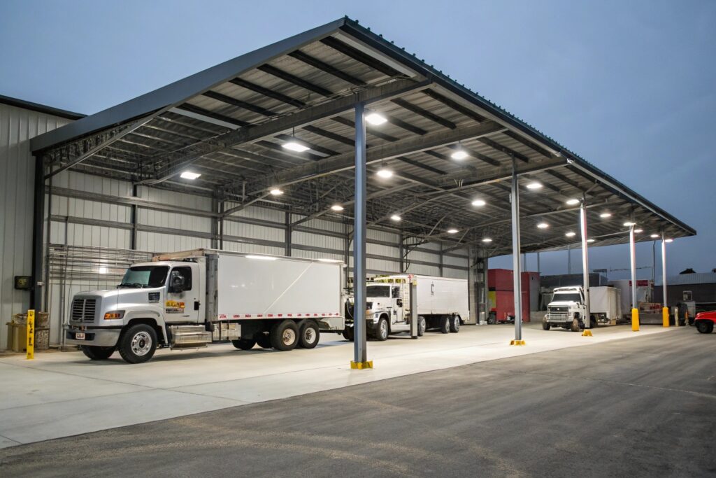 Heavy-duty commercial carport sheltering a work truck in Heatley's industrial precinct