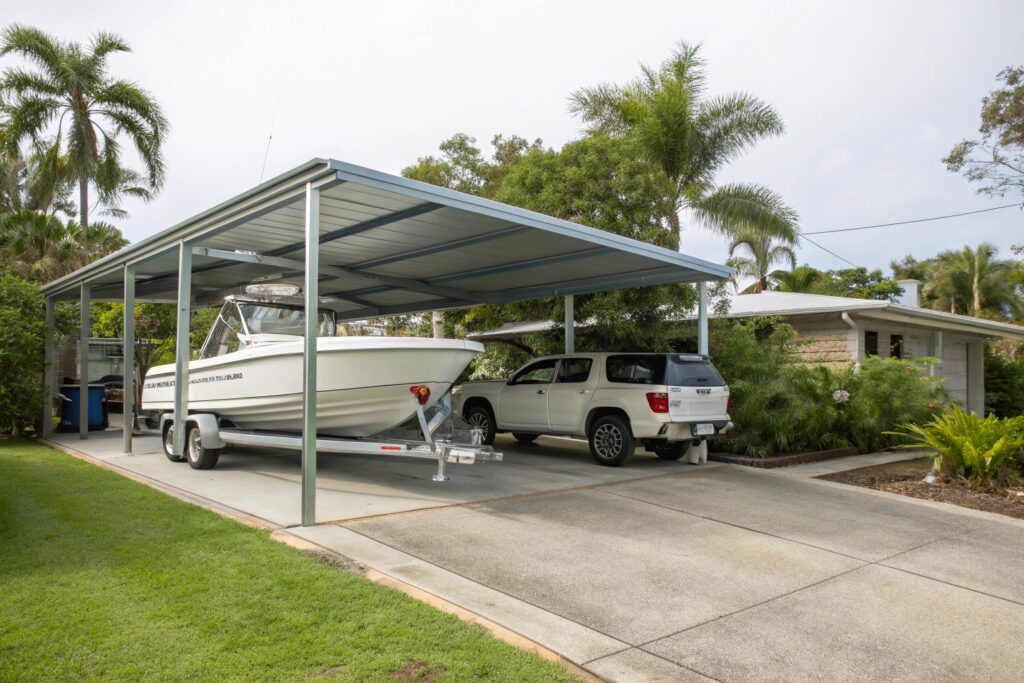 Triple carport in Wulguru combining vehicle bays with boat storage for a large trailer