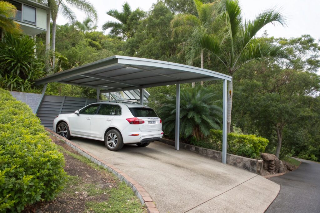 Steel carport built on a sloped driveway at a Hermit Park property